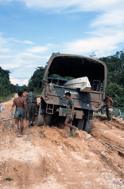 The Brazilian Army unit dig their truck out of the mud.